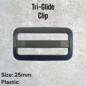 Black plastic Tri-Glide clip, 25mm, shown on a textured gray surface.
