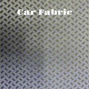 Gray car fabric with a subtle blue pattern. The texture is woven, and the image shows a close-up view of the material.