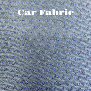 Close-up of gray fabric with a subtle wave pattern and small blue dots.